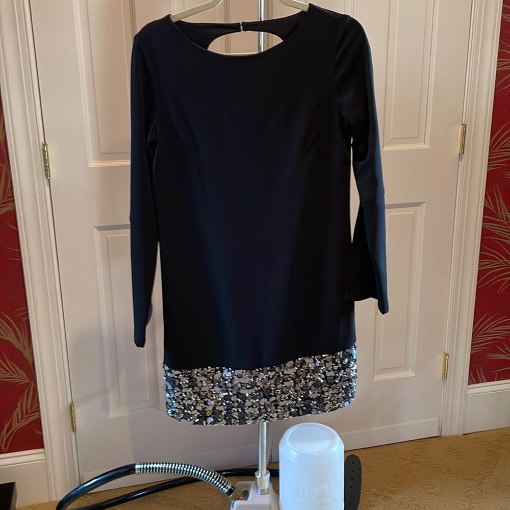 black cocktail dress with sequin hemline and split bell sleeves.  Worn once